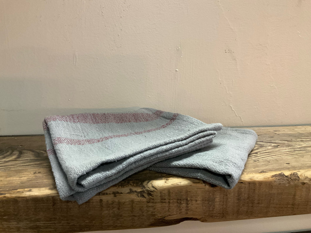Folded image of woven cotton blend tea towels gray/purple