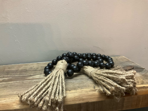 Image of black wood bead garland with tassel