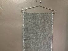 Load image into Gallery viewer, Product shot of linen blend table runner with frayed edges - charcoal in a hanger
