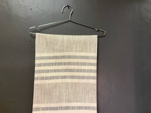 Product shot of woven cotton striped table runner