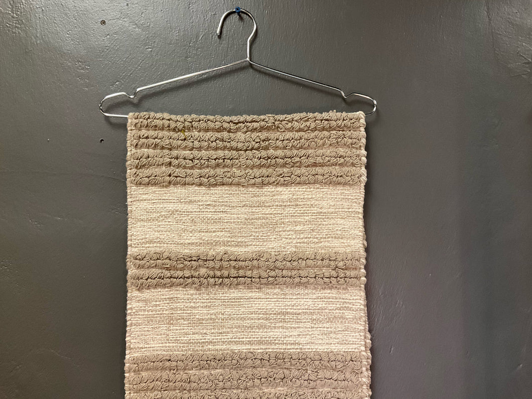 Product shot of taupe table runner-hand woven 14x72