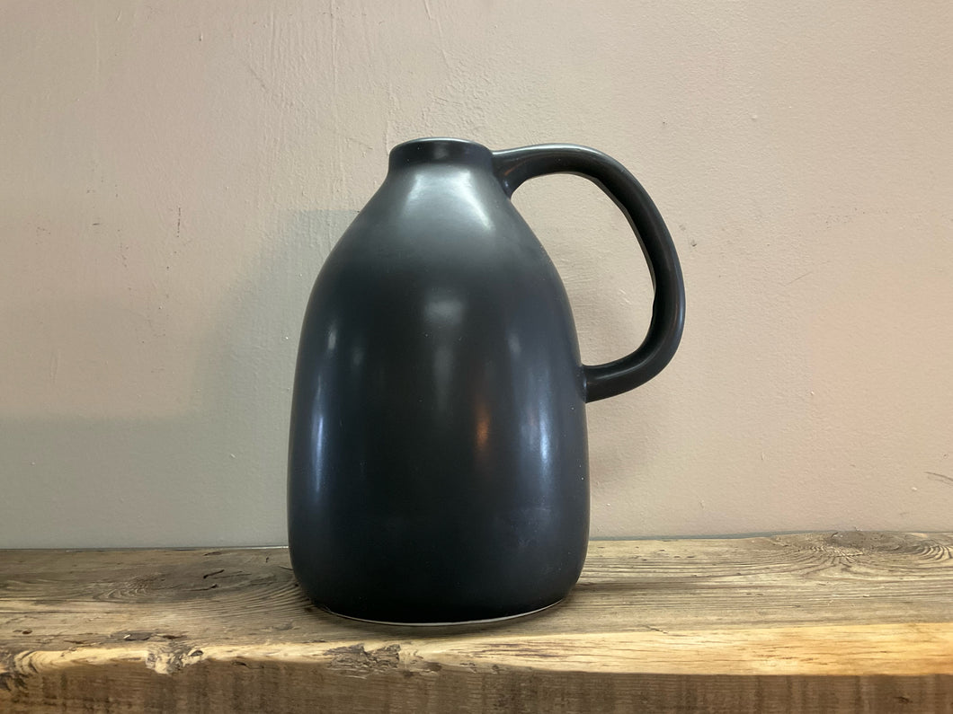 Product shot of ceramic vase with handle, matte black